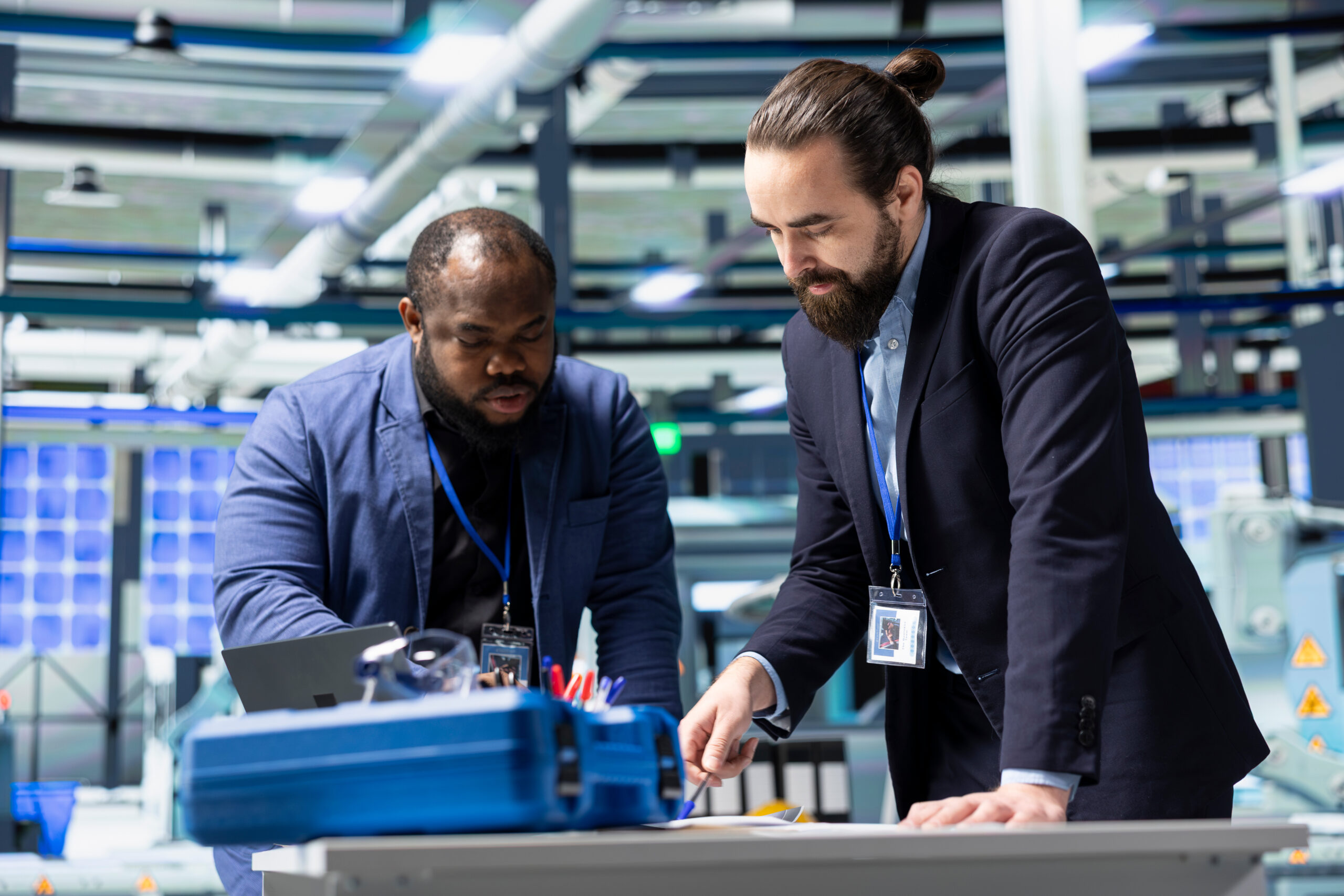 Two men working on technology for ARC services